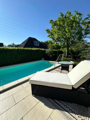 Haus Bettina, im Garten zuhause in Harrislee